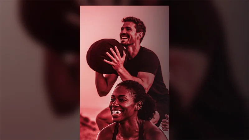 Athletes carrying a medicine ball during The Redline